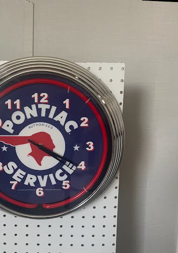 Montana Services custom neon clock with red glow