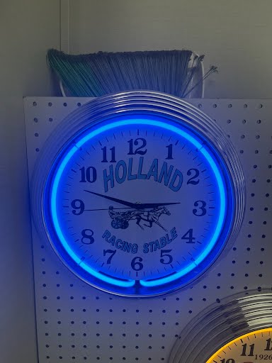Blue custom neon clock wrapped for delivery